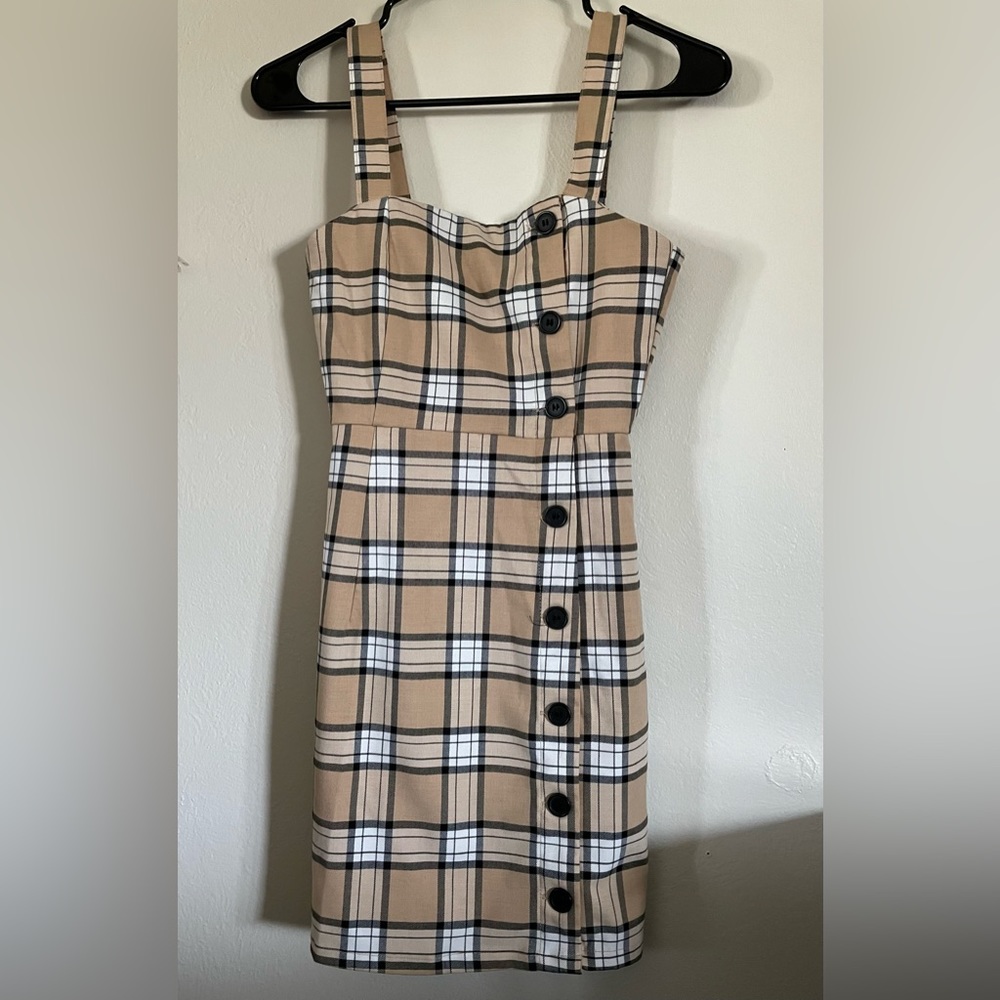 H&M Divided overall dress Tan and white plaid mini dress with button detailing.